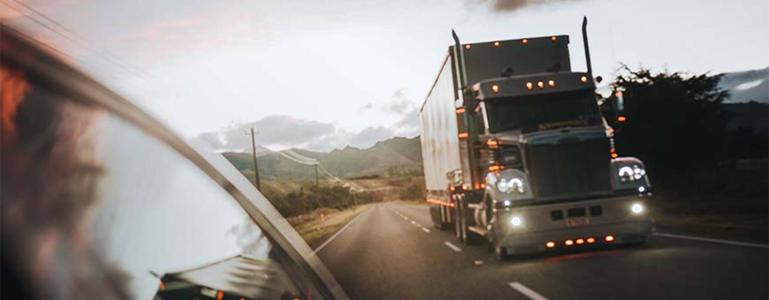 Transport Truck driving on road, powered by Keystone alternator and starter.